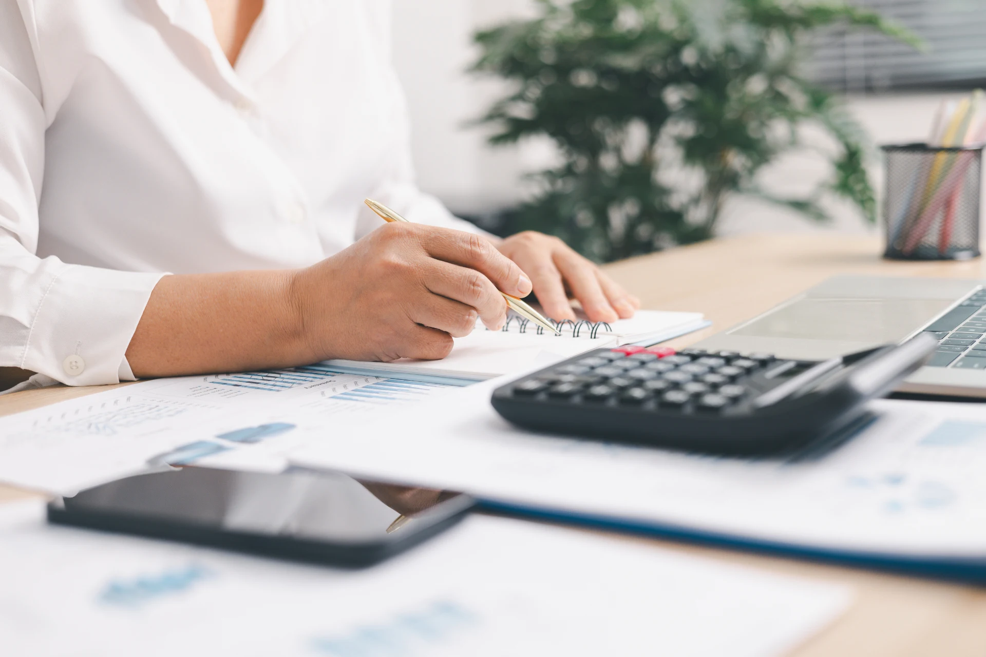 A clean workspace with financial documents, reflecting Fintrix Advisory's hands-on practitioner work